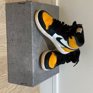 Boys yellow and black Jordan 1 size 13 little kids.